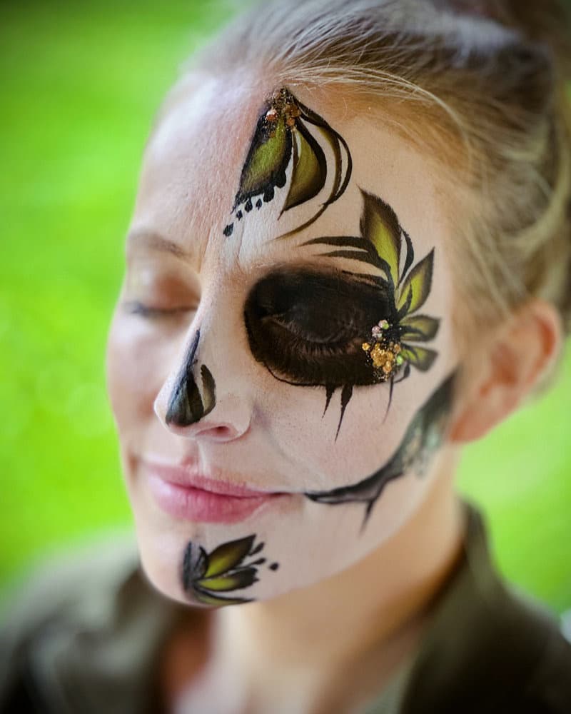 Sugar skull with green leaves