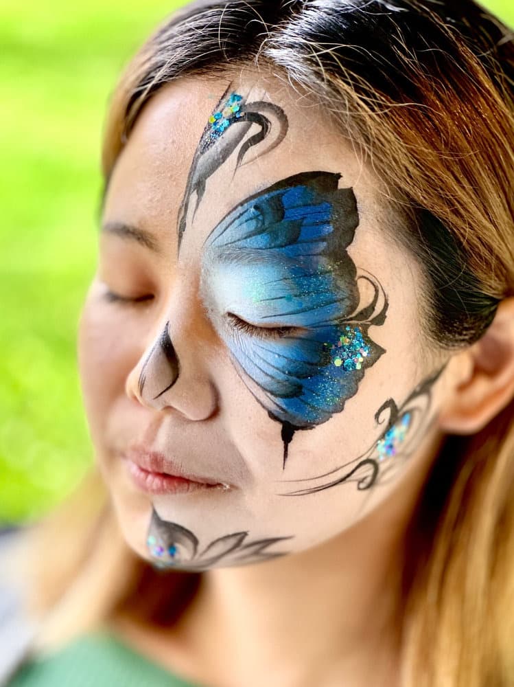 Blue butterfly half sugar skull