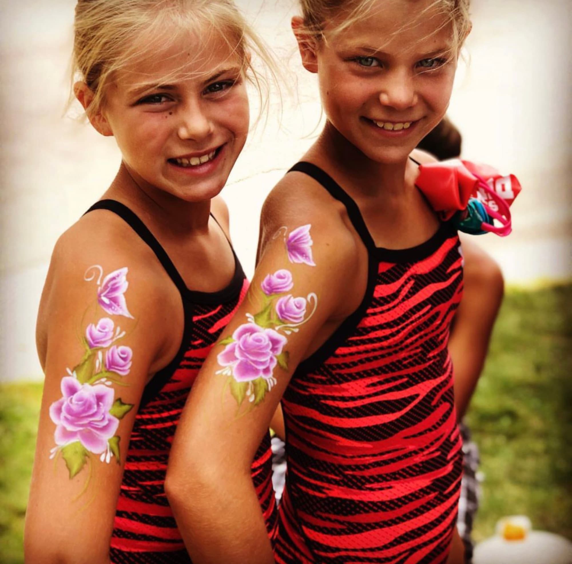 Floral arm designs on two girls