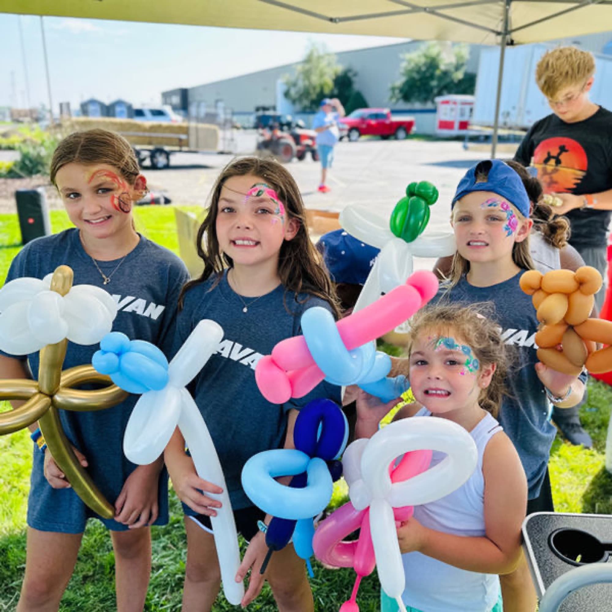 Kids with their balloon creations