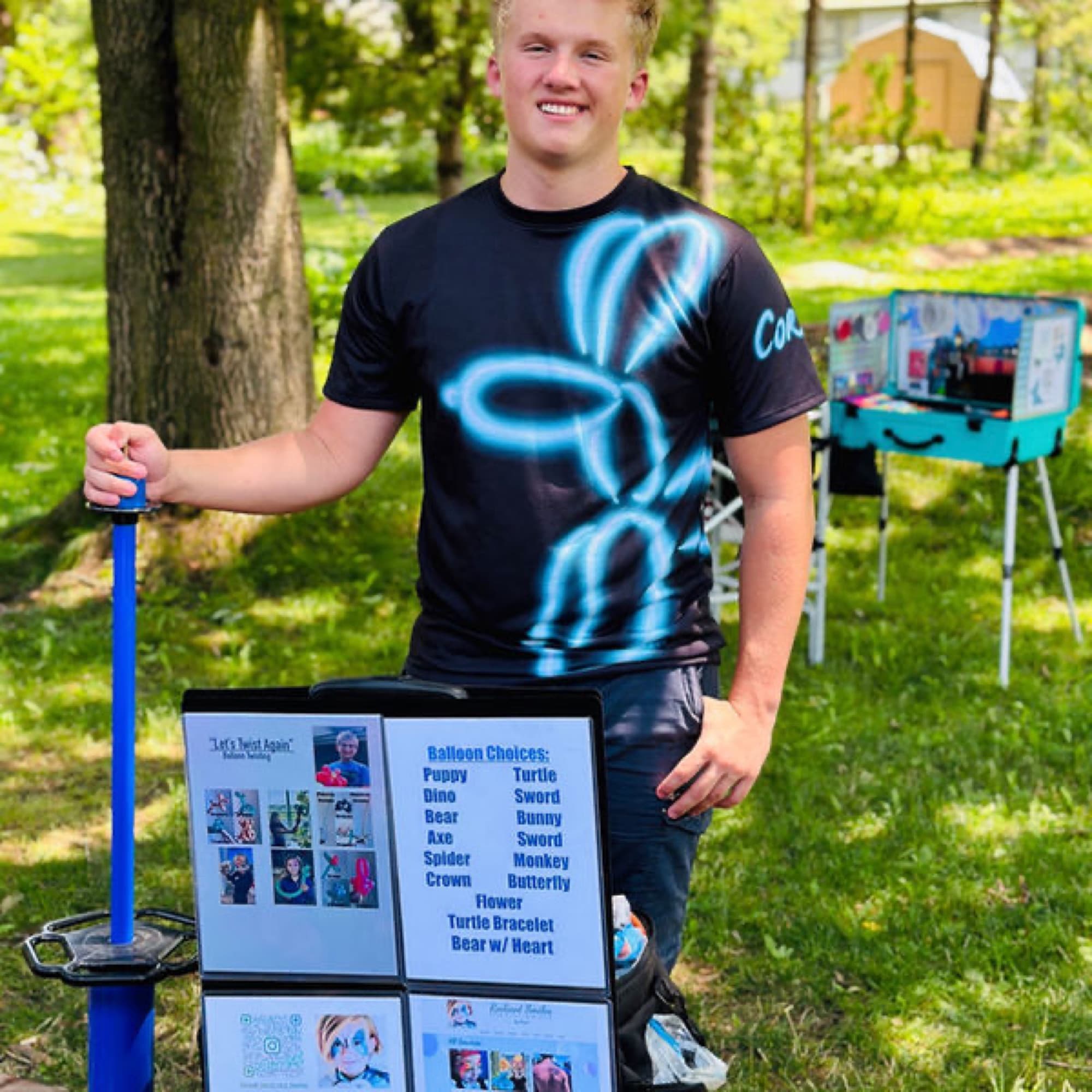 Balloon twister with his menu board