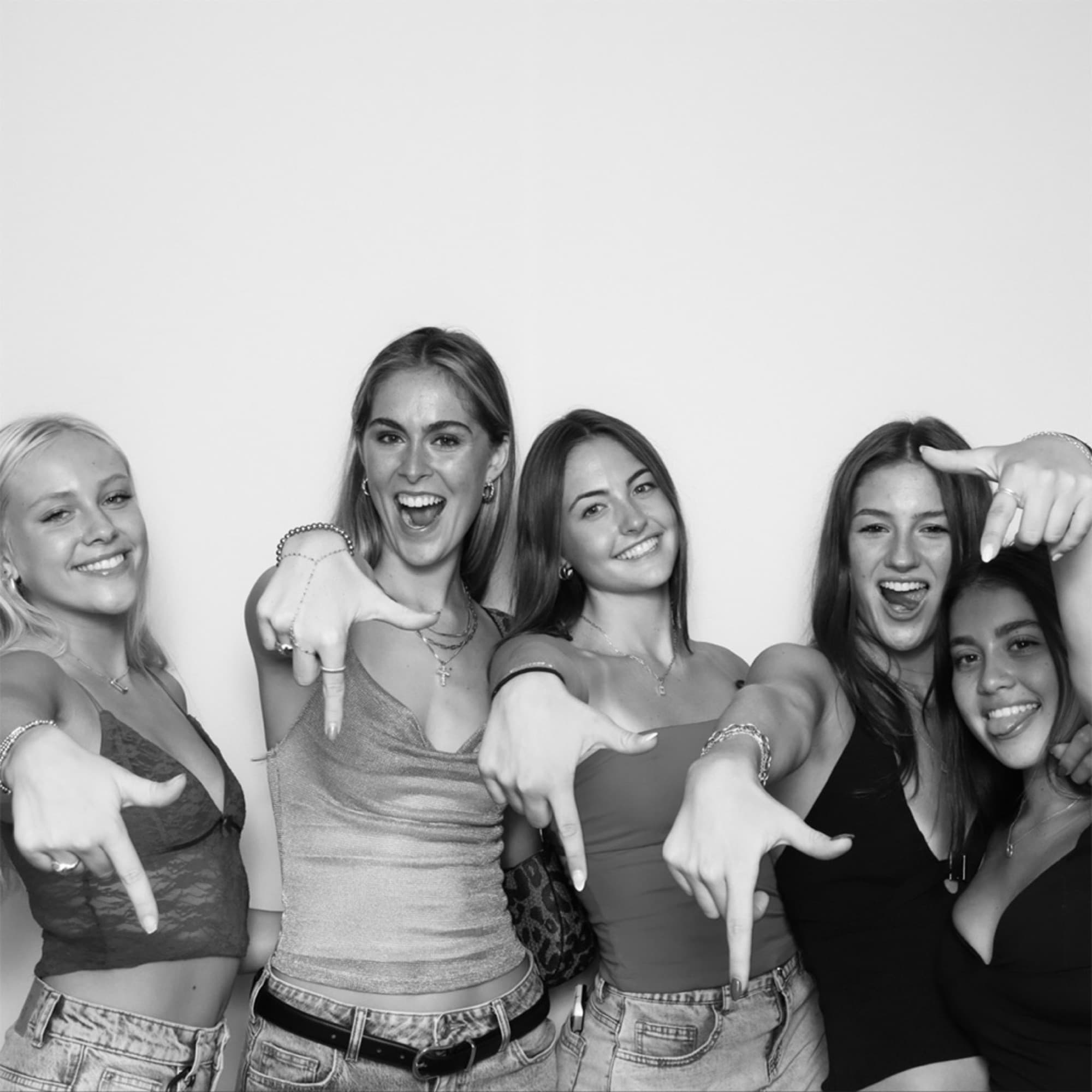 Black and white group of friends striking poses
